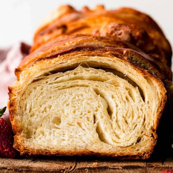 slices of golden croissant bread showing flaky layers inside
