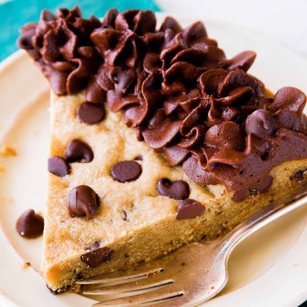 slice of chocolate chip cookie cake with chocolate buttercrea