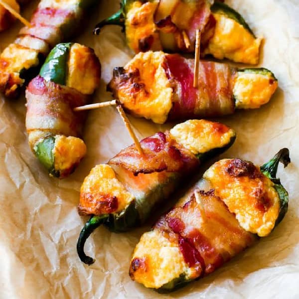 picture of bacon wrapped cheese stuffed jalapenos on a platter