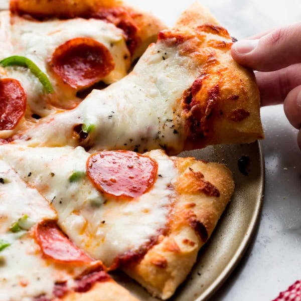 homemade pizza with pepperoni and green peppers