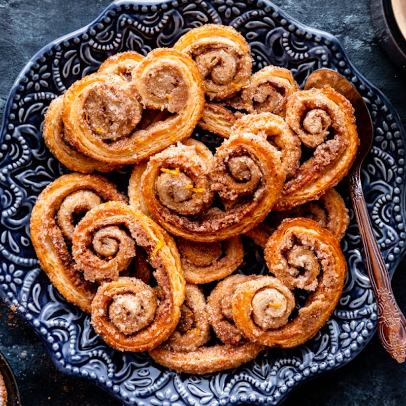 palmier cookies on blue plate