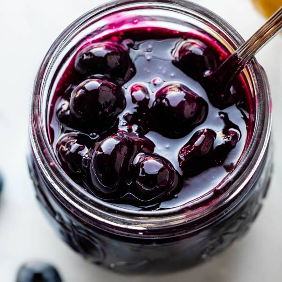 a mason jar of blueberry sauce