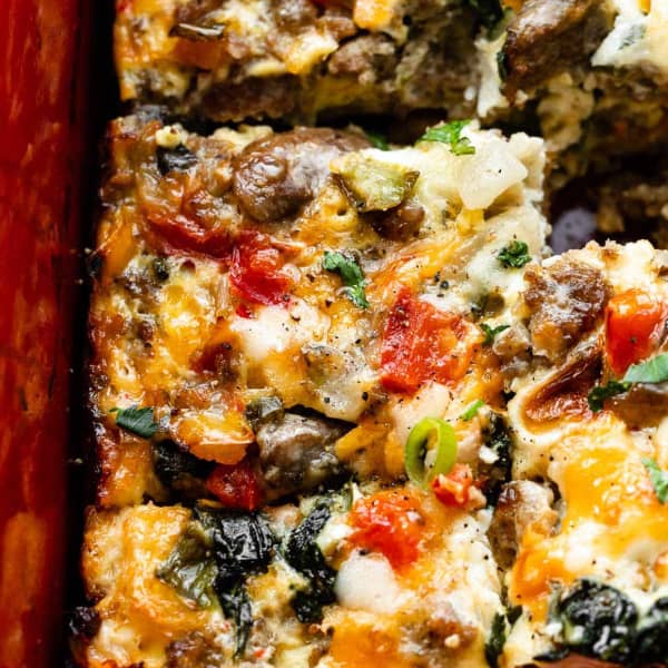 Slices of breakfast casserole with sausage and veggies