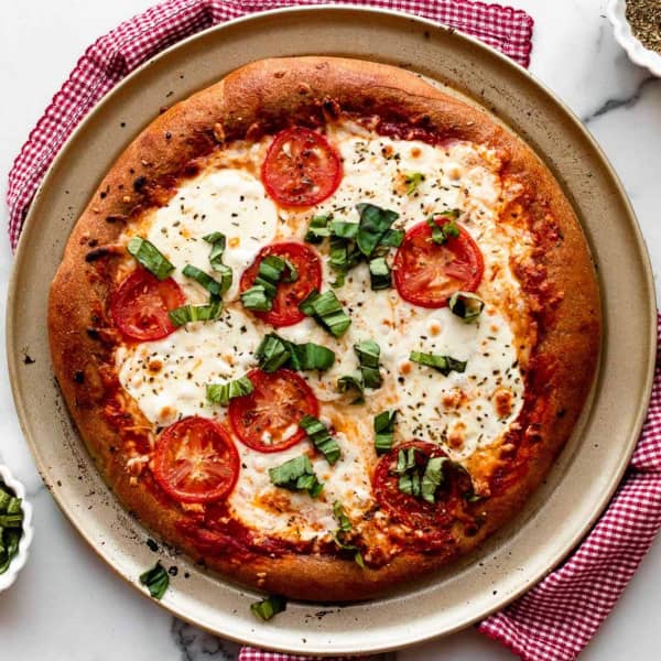 whole wheat pizza on a pizza pan