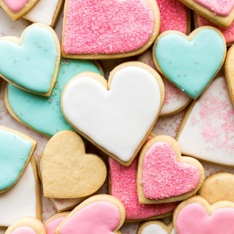 Picture of sugar cookies in heart shapes with royal icing. 