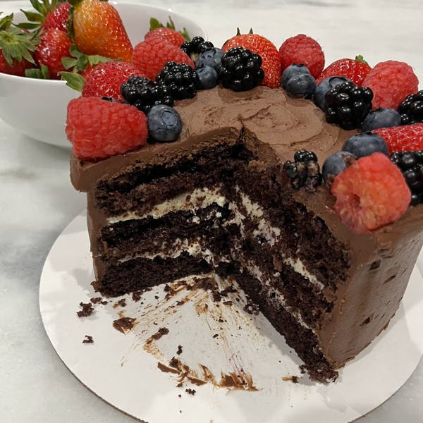 tuxedo cake with berries on top