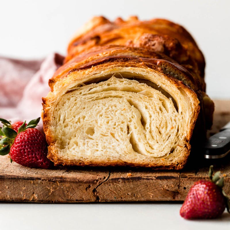 picture of a loaf of croissant bread on a cutting board