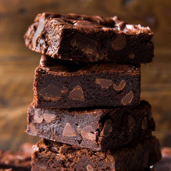 stack of fudgy brownies with chocolate chips