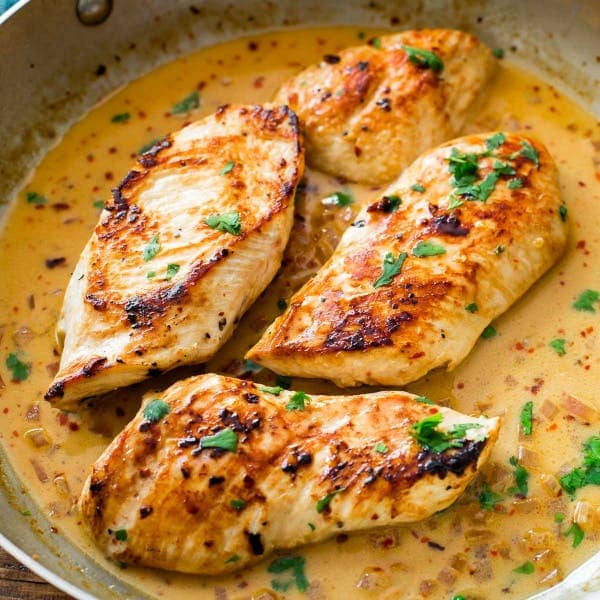 picture of cilantro lime sauce chicken in a skillet