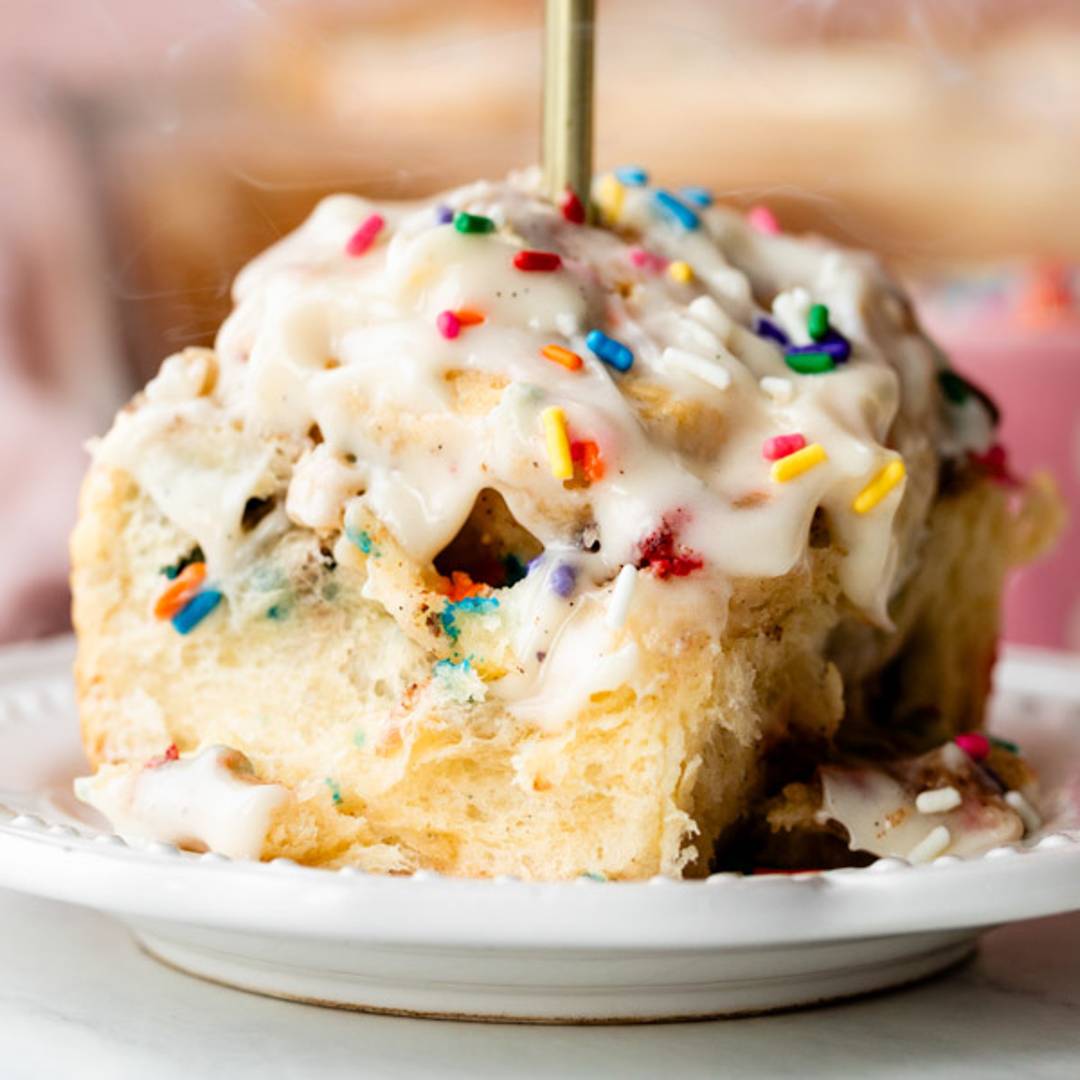 birthday cake cinnamon roll with icing