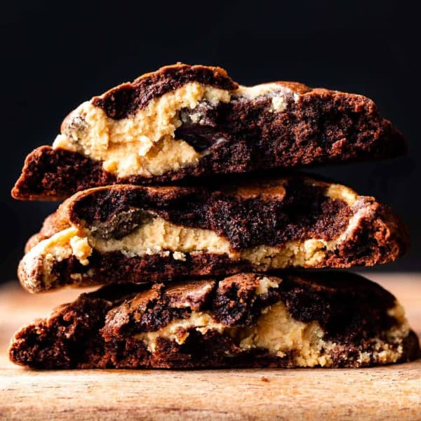 stack of chocolate cookies, showing peanut butter swirl throughout 