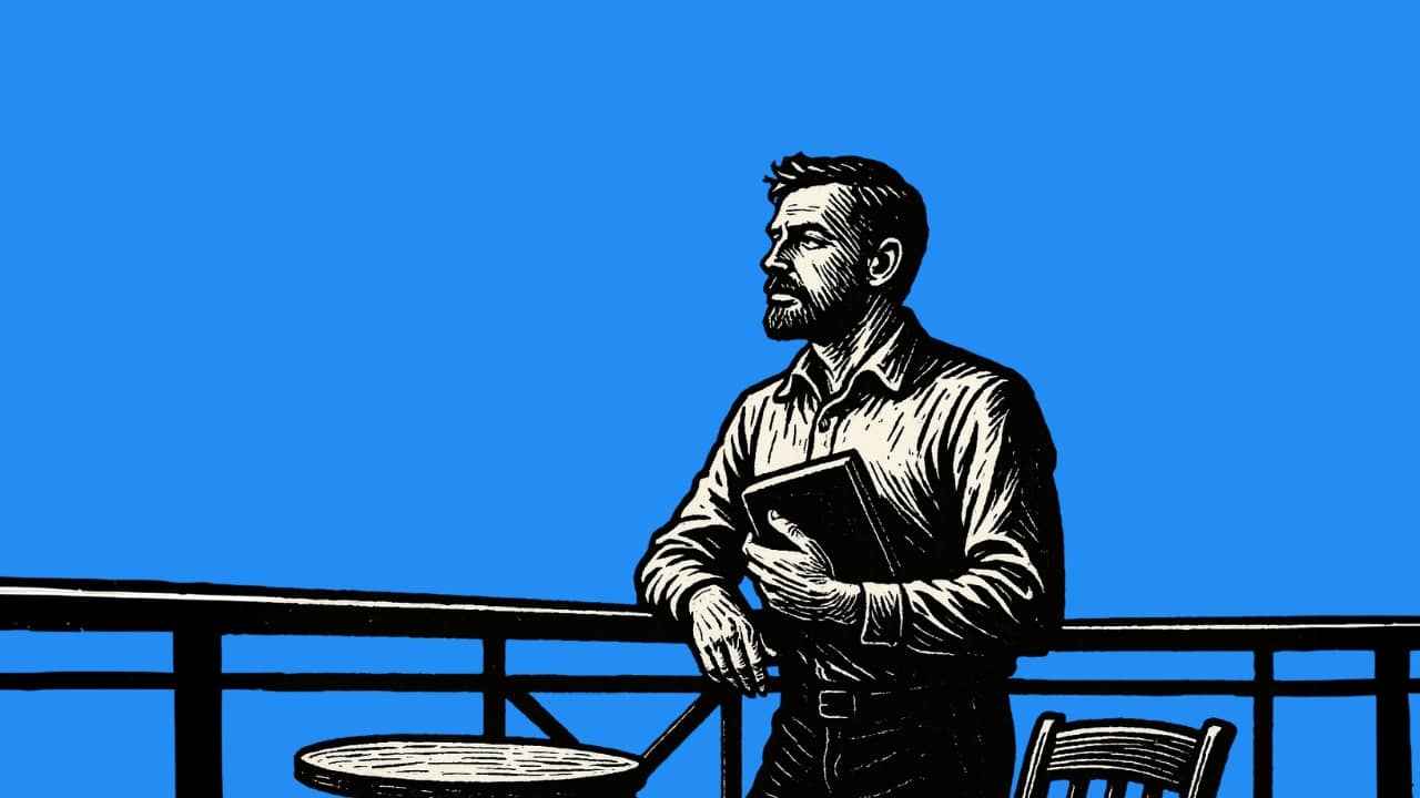 A man thoughtfully looking at the sky with a book in his hand