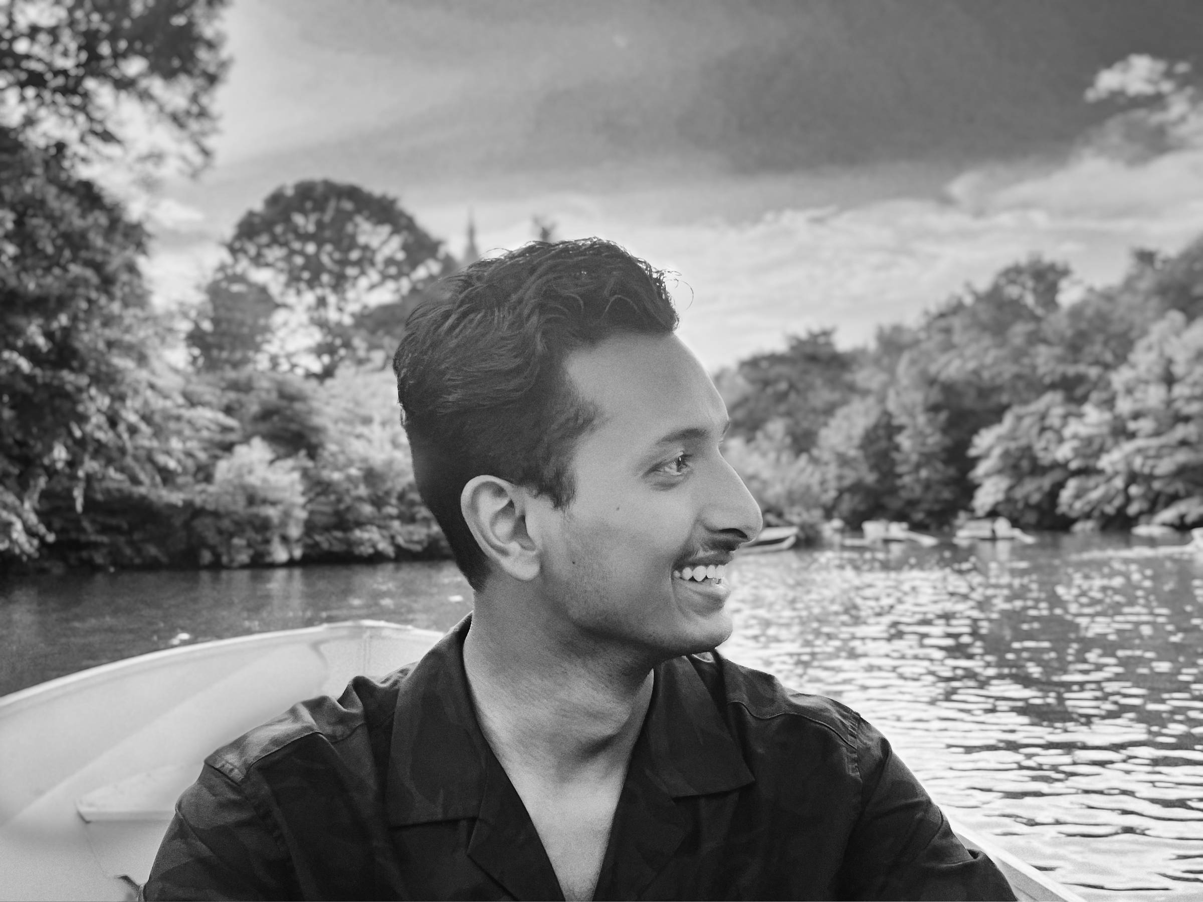 Suraj laughing in a picturesque background