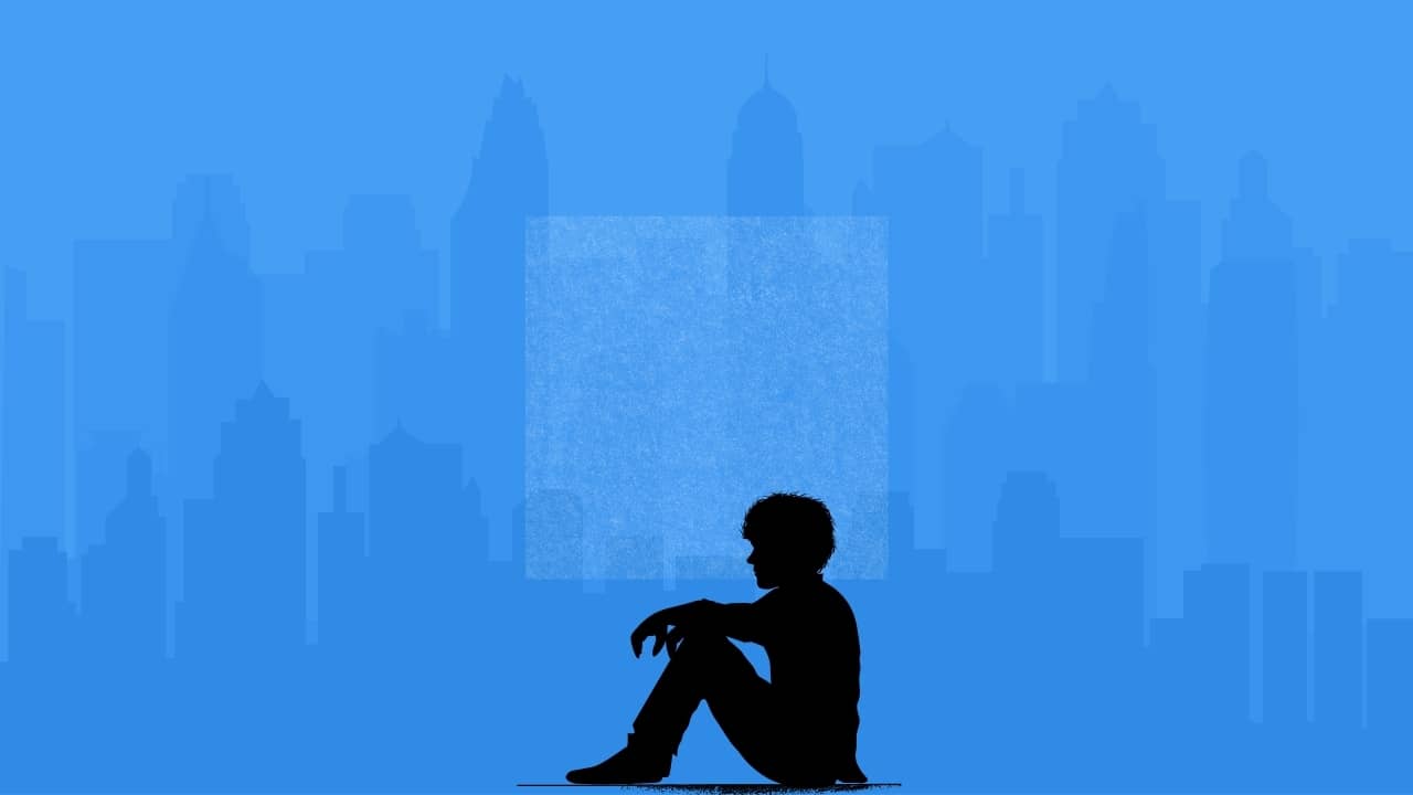 A boy sitting alone