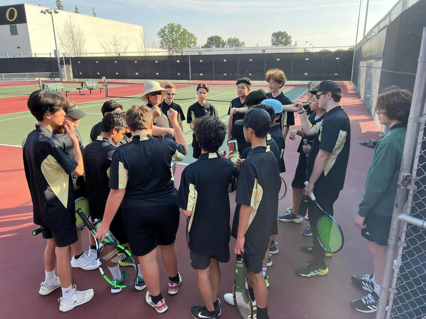 🎾 Go Hawks!  JV men’s group huddle with Coach Bodie before their match with Eleanore Roosevelt.