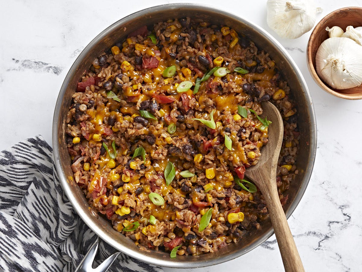 Overhead view of a skillet full of Southwest lentils and rice