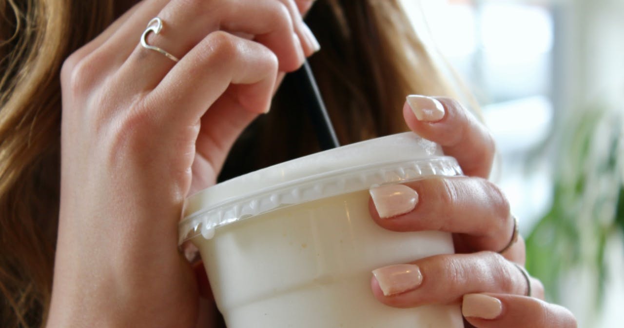 woman drinking whey protein shake