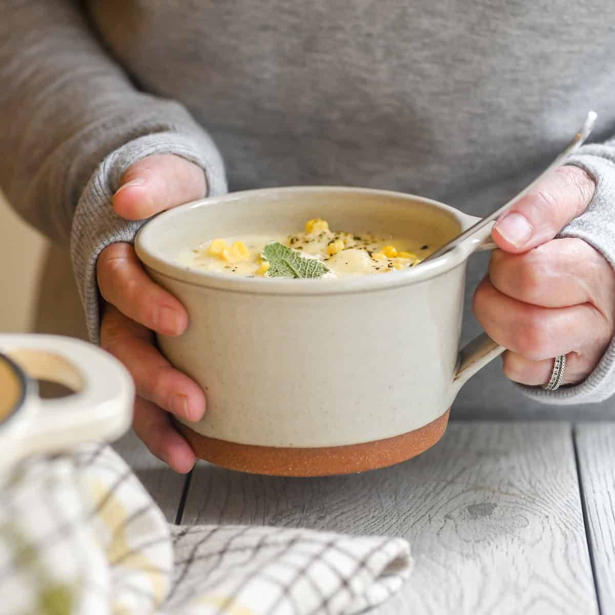Corn and cheddar cheese chowder in a mug