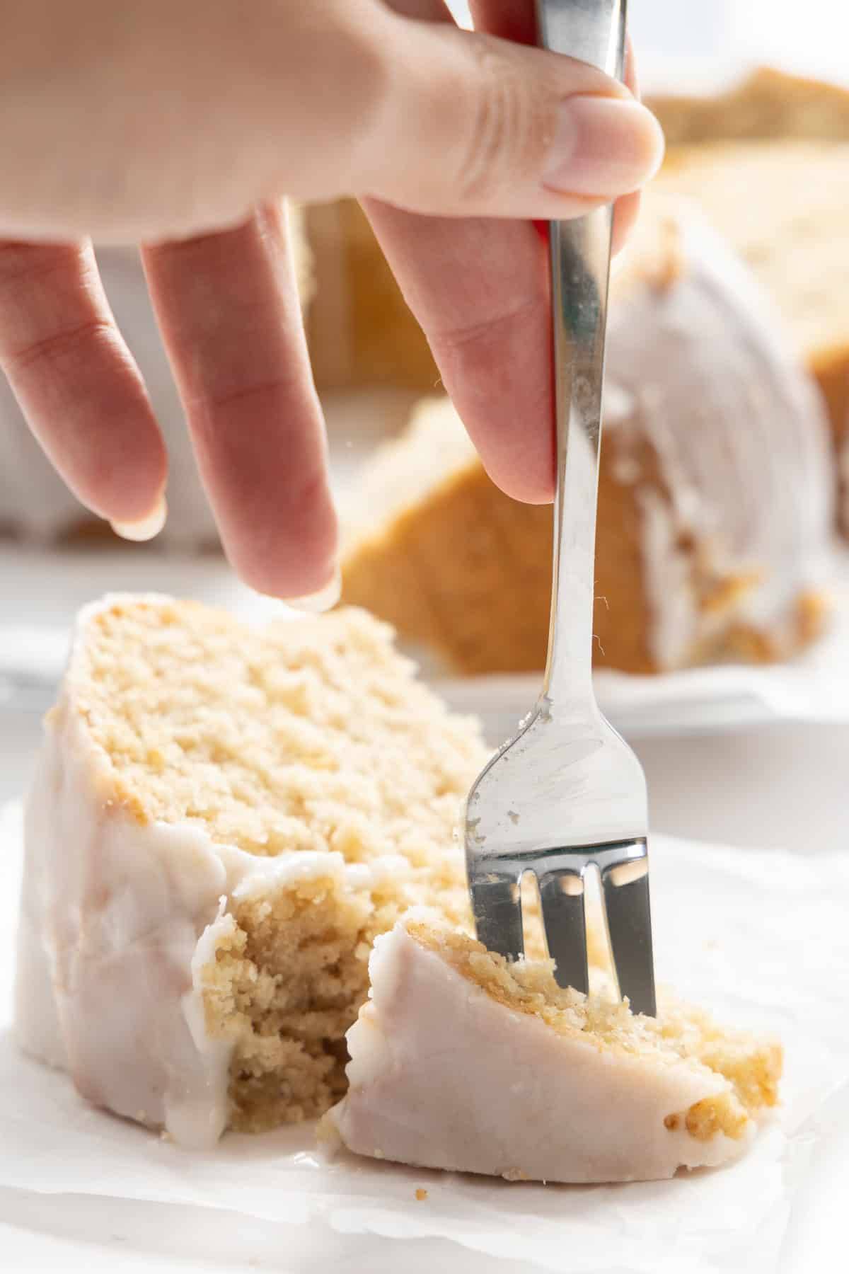 The bite shot of a piece of coffee cake.