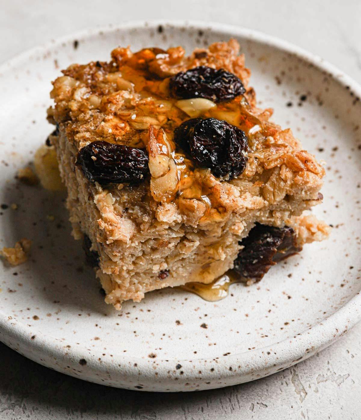 A square of baked oatmeal on a plate.