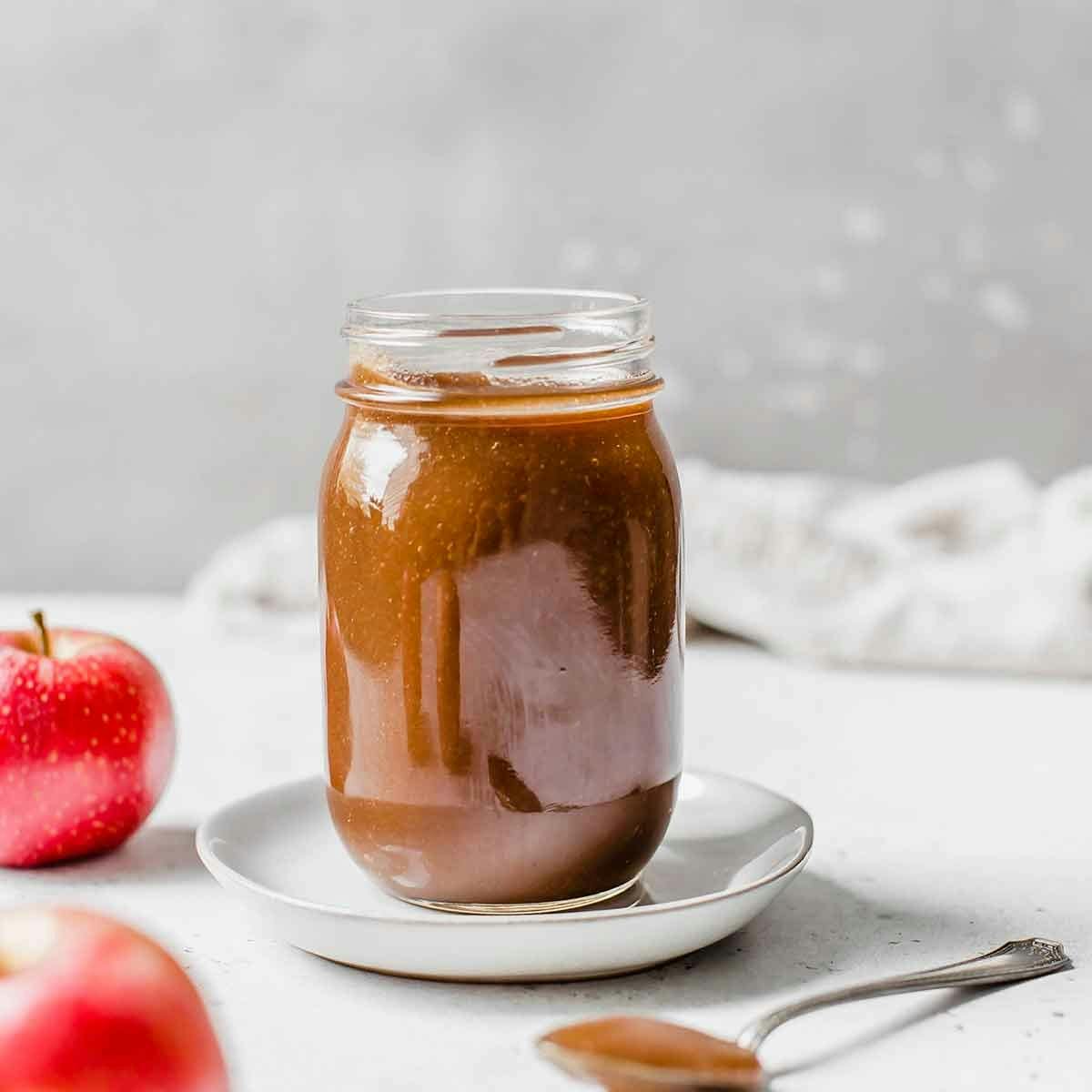 Apple butter in a glass jar.