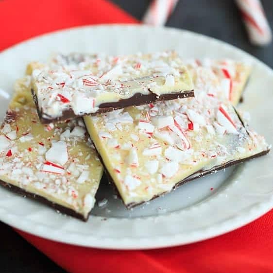 Pieces of peppermint bark on a white plate.