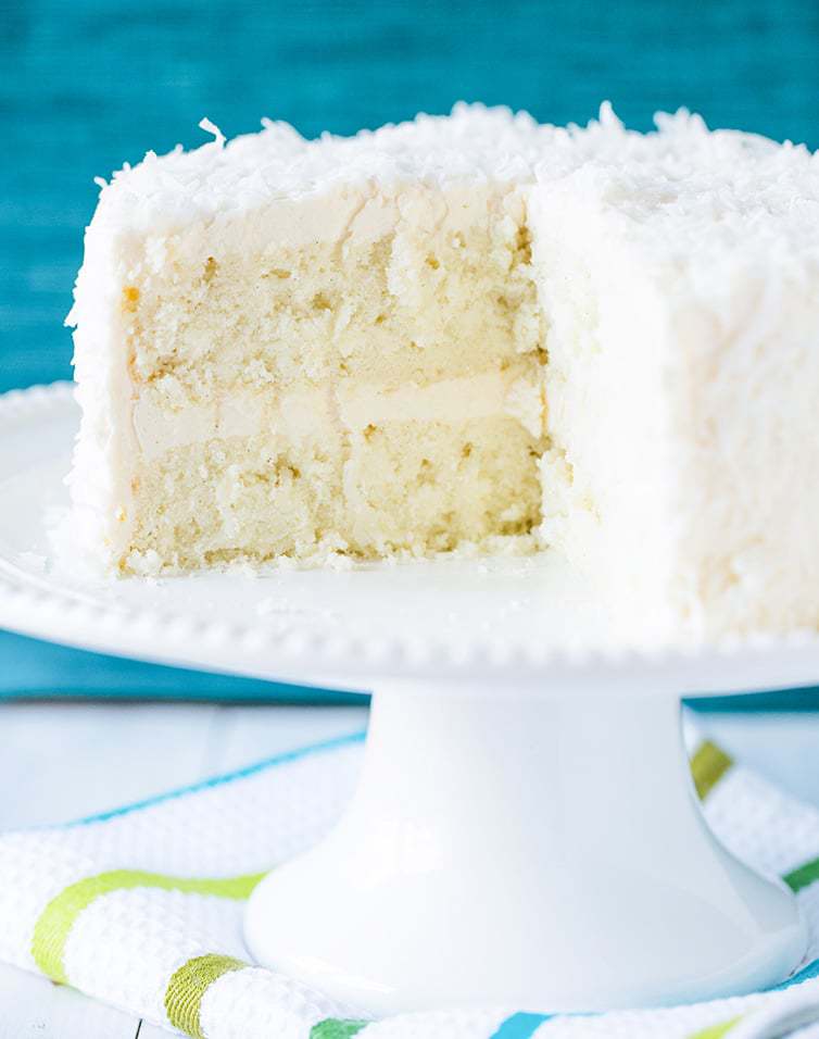 coconut cake on a white cake stand