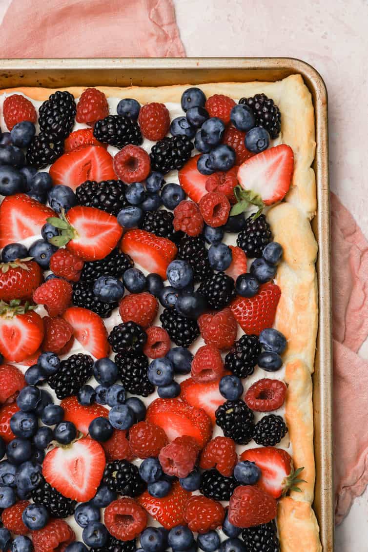 overhead image of fruit pizza in a baking sheet