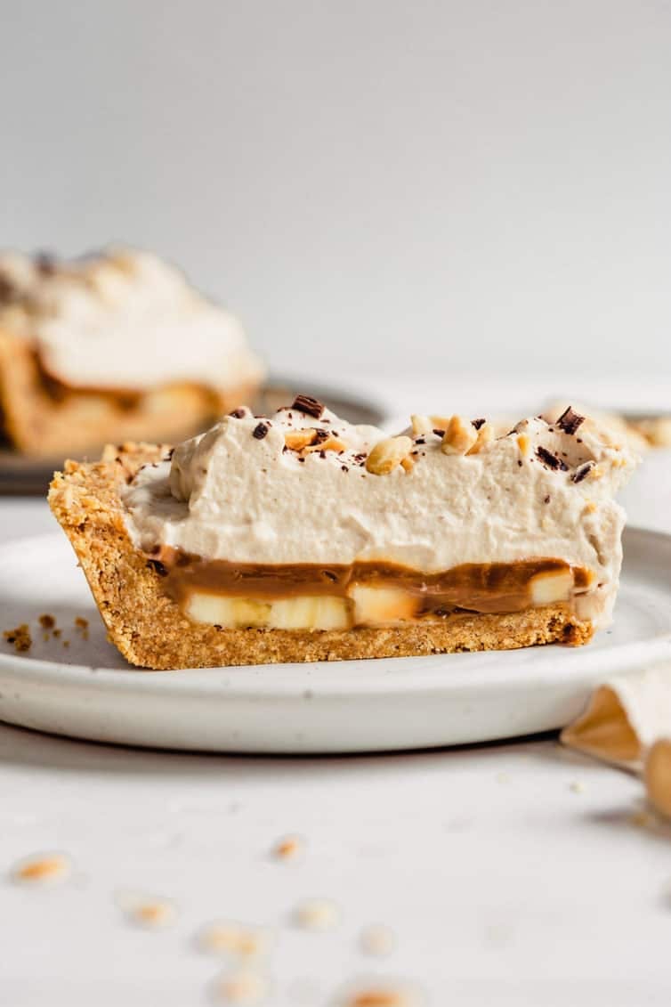 side view of a slice of banoffee pie on a plate