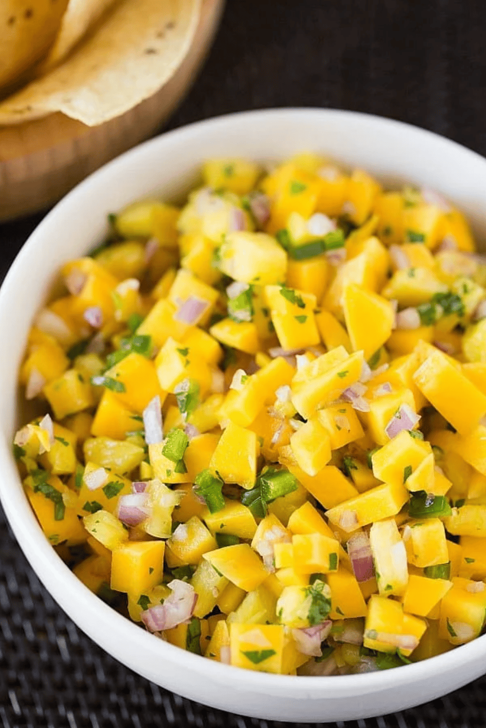 mango pineapple salsa in a white bowl