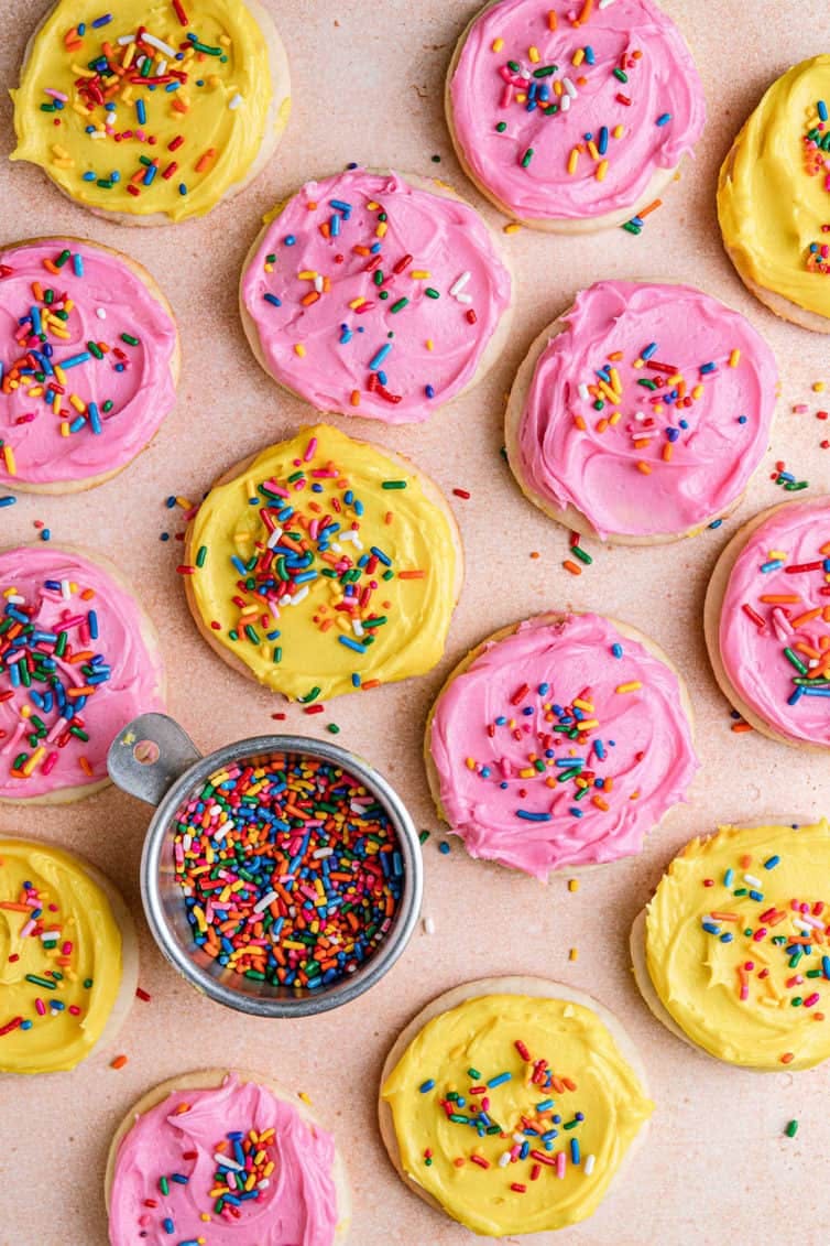 overhead image of frosted cookies with sprinkles