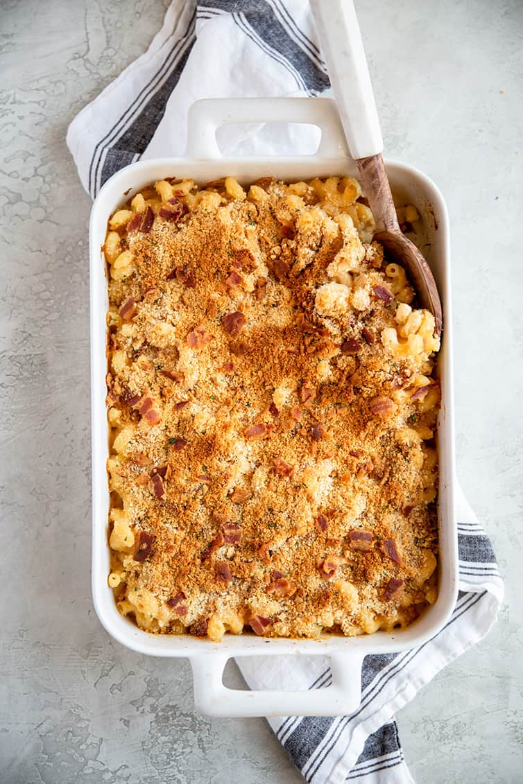 overhead image of macaroni and cheese in a white baking dish after baking