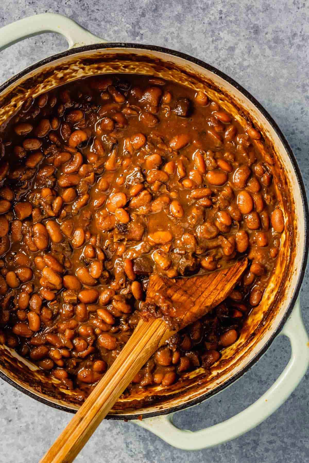 overhead image of baked beans in a dutch oven