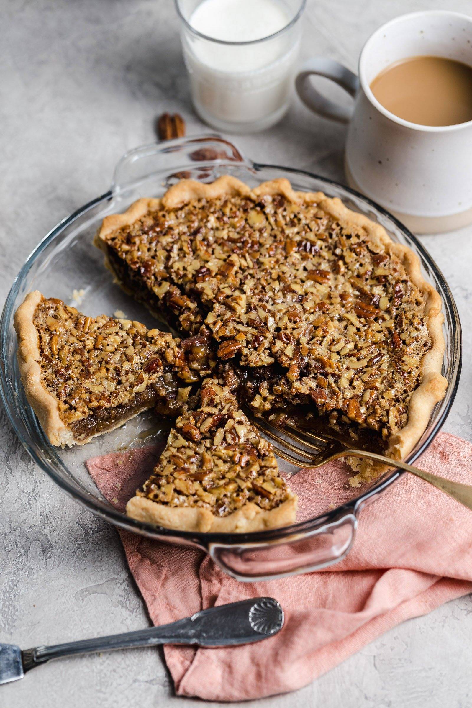 Overhead image of pecan pie in a glass pie dish.