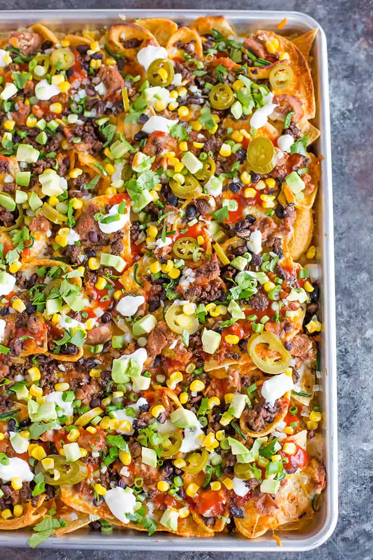 overhead image of nachos on a sheet pan