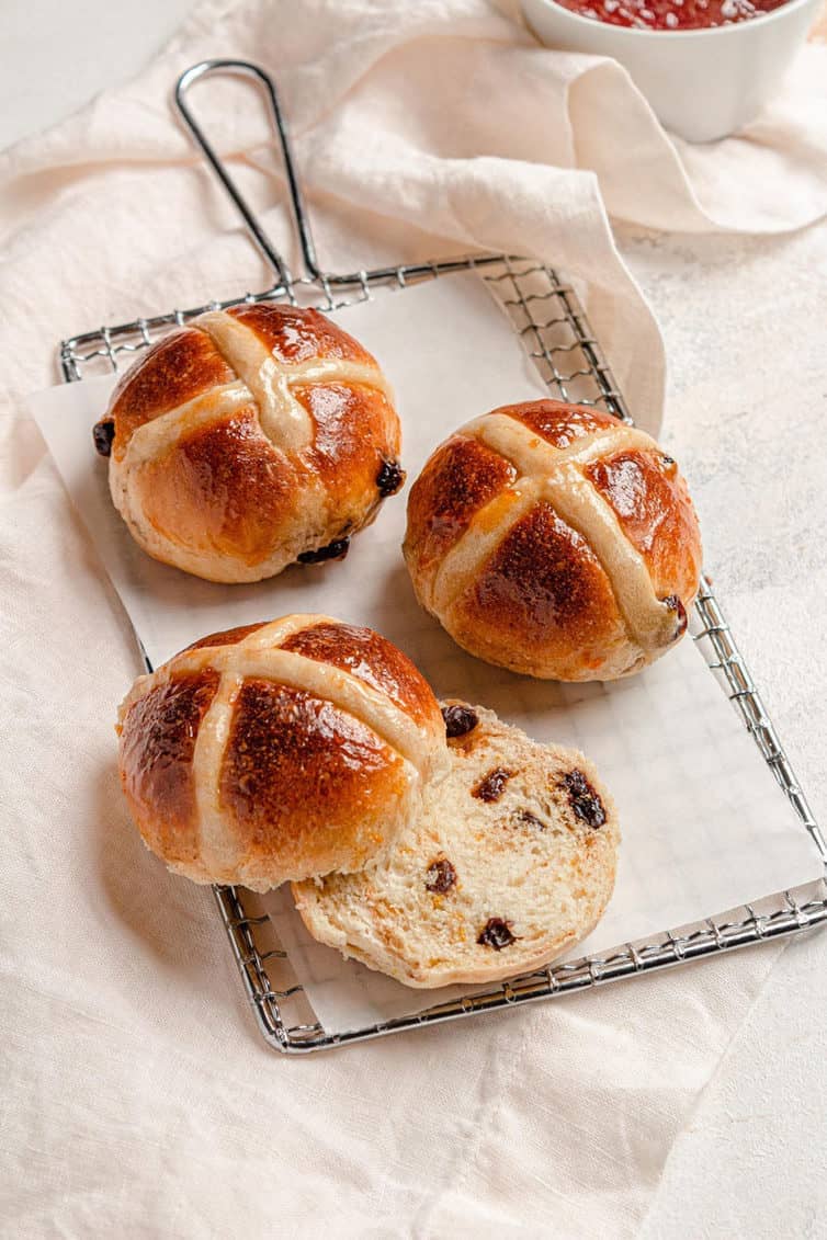 hot cross buns on a cooling rack