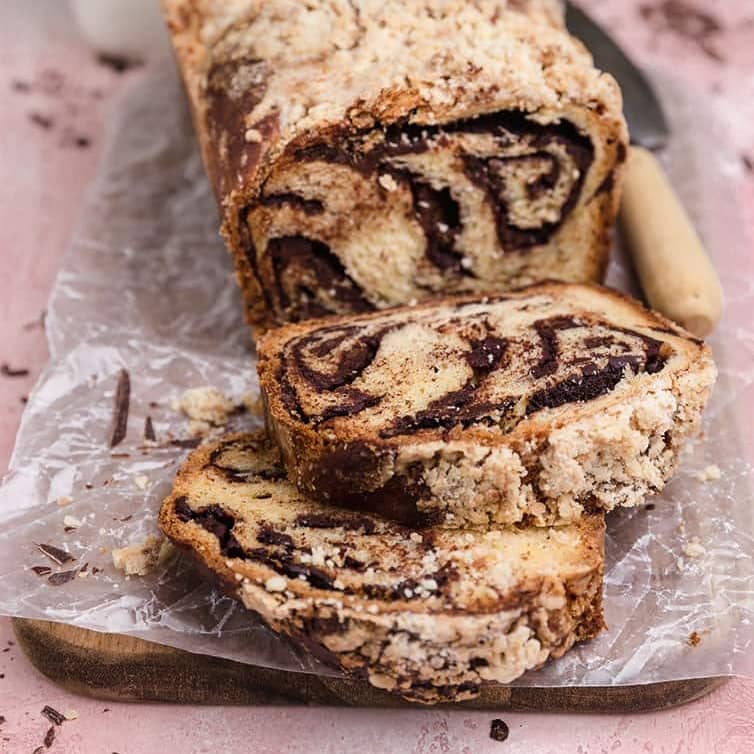 Loaf of chocolate babka with slices cut.