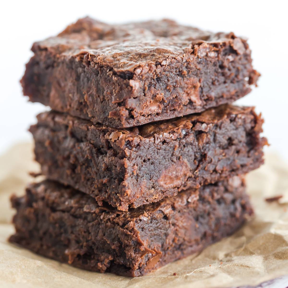 Overhead image of chocolate frosted brownies topped with sprinkles.
