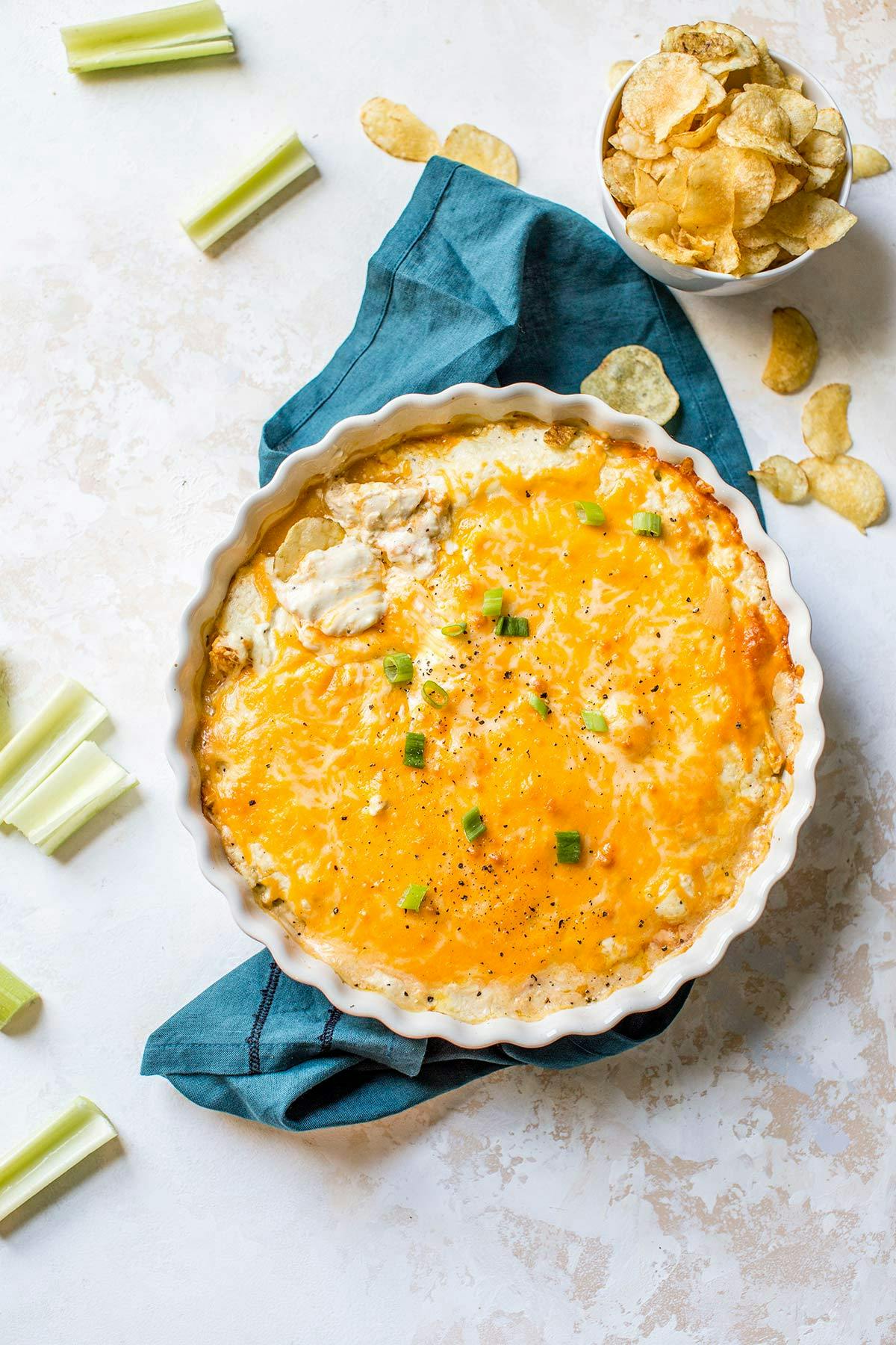 overhead image of Buffalo chicken dip in a white serving dish