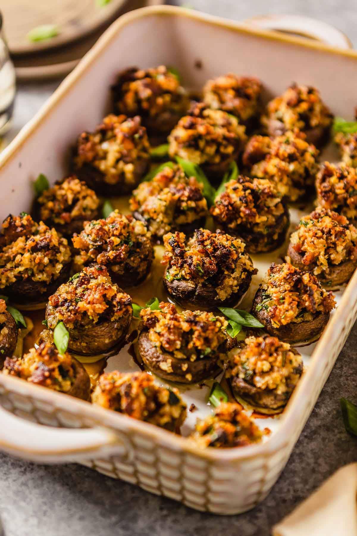 sausage stuffed mushrooms in a baking dish