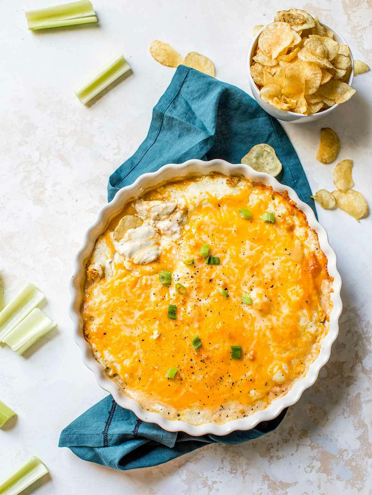 Overhead image of Buffalo chicken dip in a white baking dish.