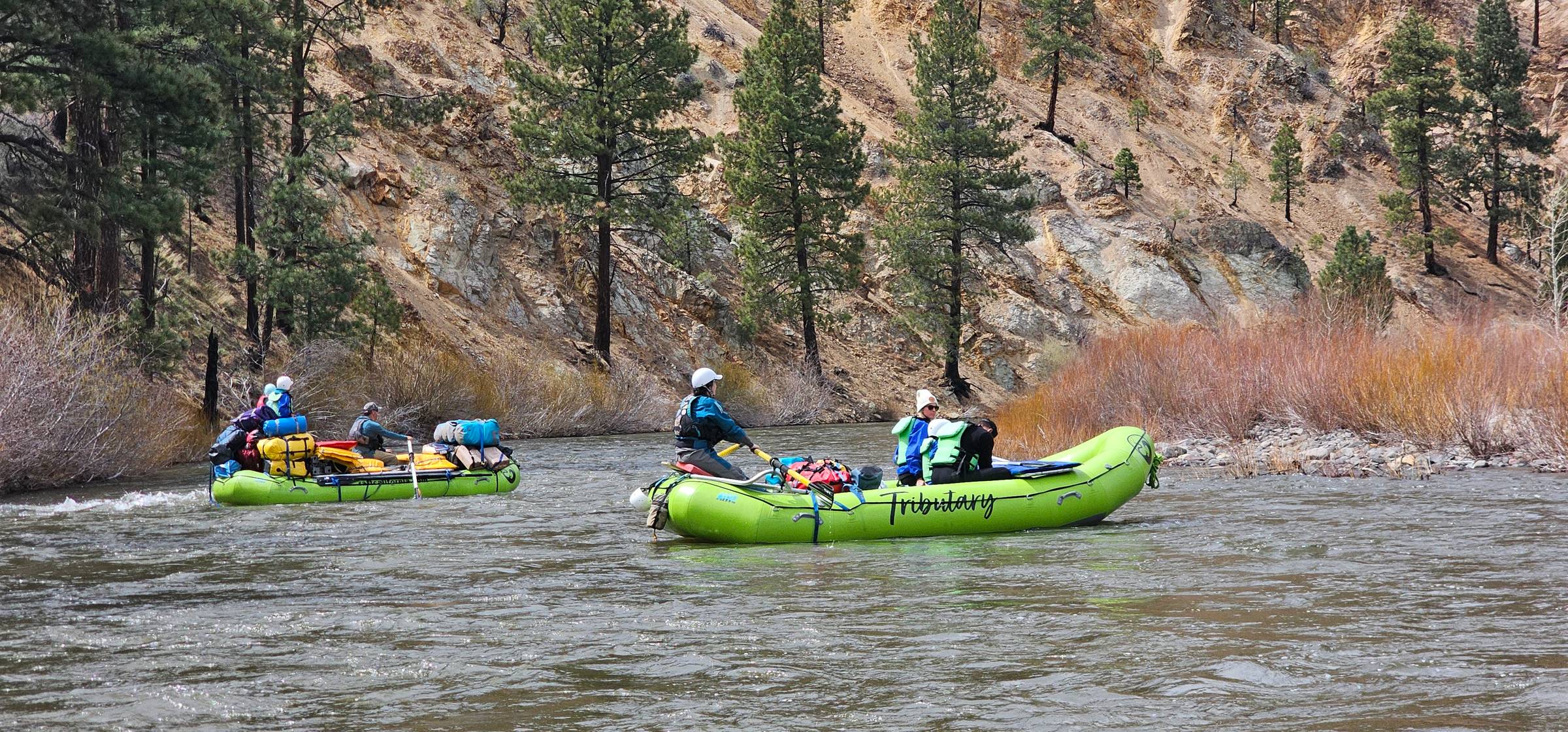 people rafting river