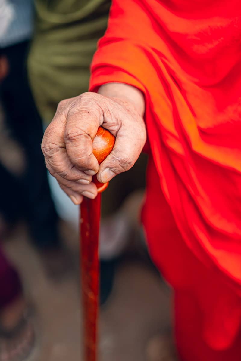 A close up of a person holding a stick