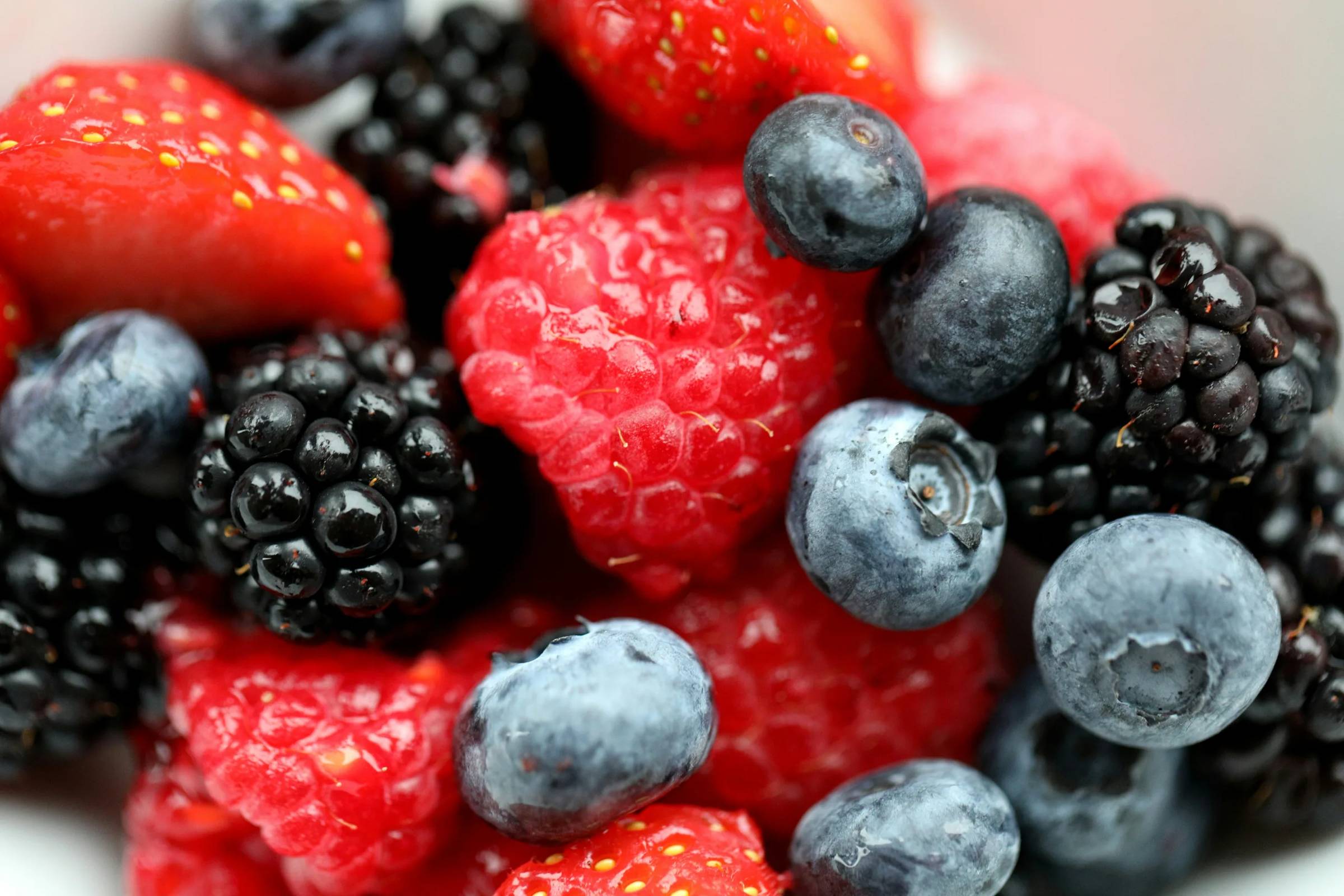 A bowl of blueberries and walnuts, key anti inflammatory foods