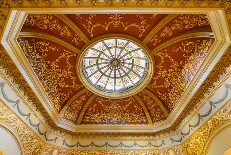 a ceiling with a circular glass window in it