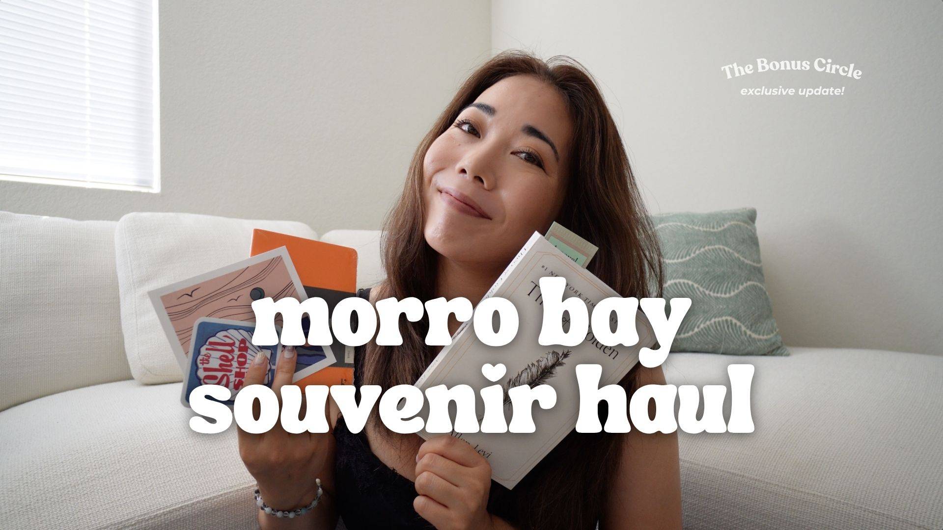 remi holding up morro bay souvenirs + text that says "morro bay souvenir haul"