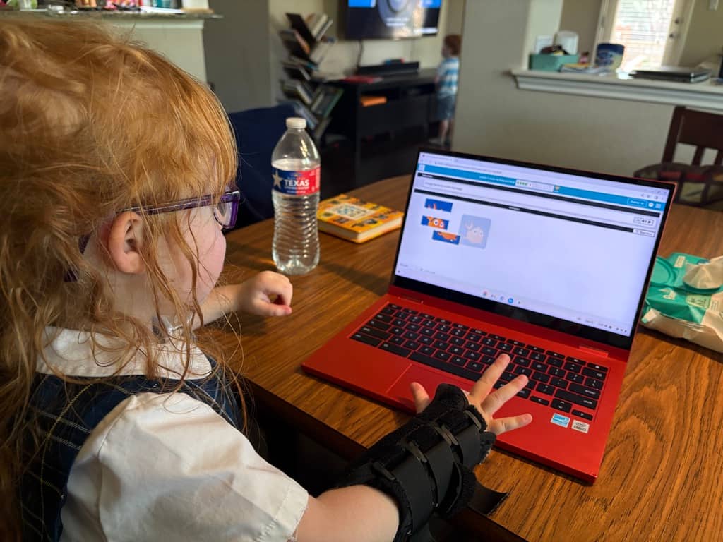 girl on laptop with basic code exercise on screen