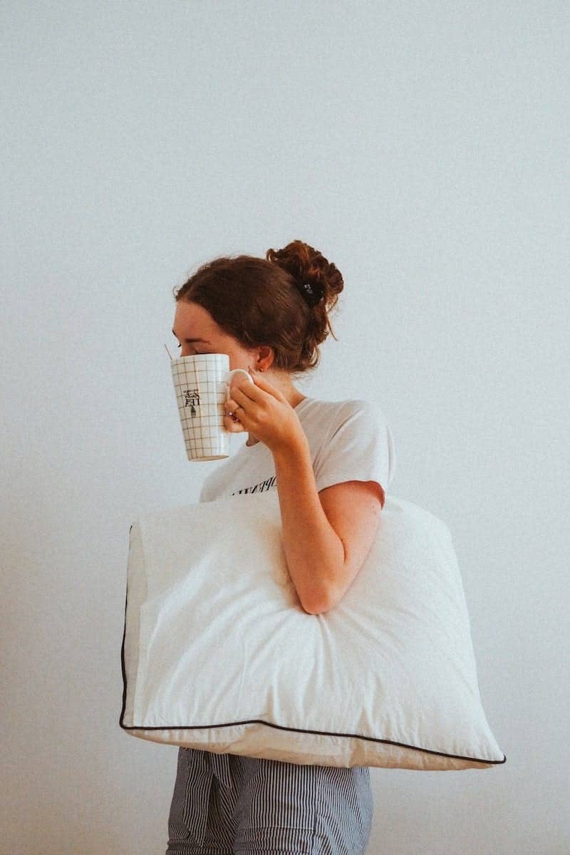 woman in white t-shirt reading book