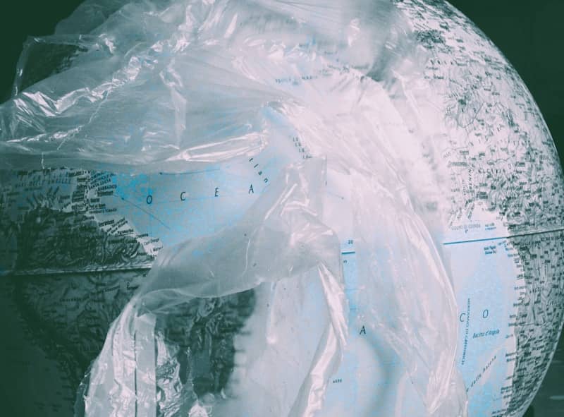 Globe covered in translucent plastic wrap