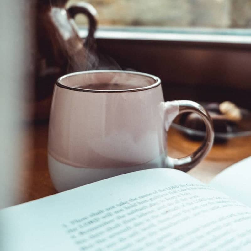 white ceramic mug on white ceramic saucer